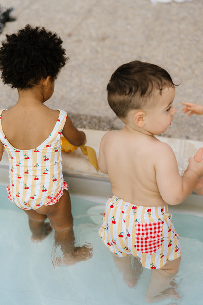Capri soleil | Costume da bagno intero bimba a righe bianche/gialle con ciliege